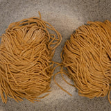 Rye noodles from above, the two portions in a pack side by side